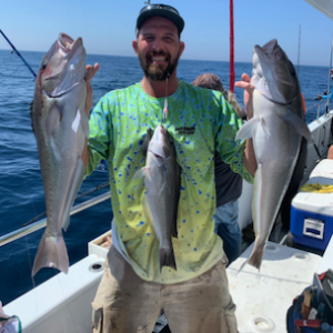 a man holding a fish