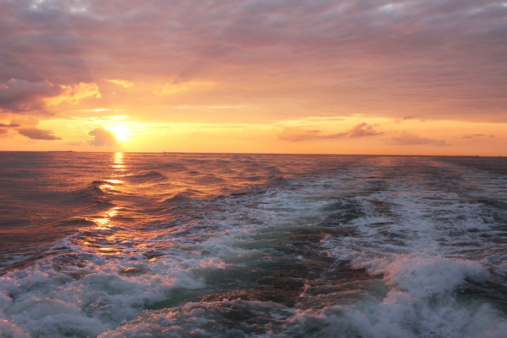 a sunset over a body of water