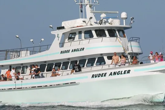 a group of people on a boat in the water
