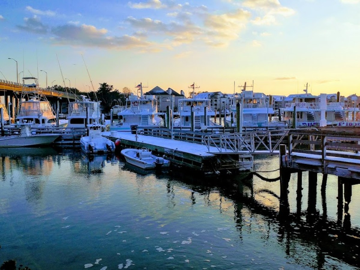 a boat is docked next to a body of water