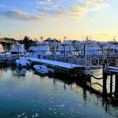 a boat is docked next to a body of water