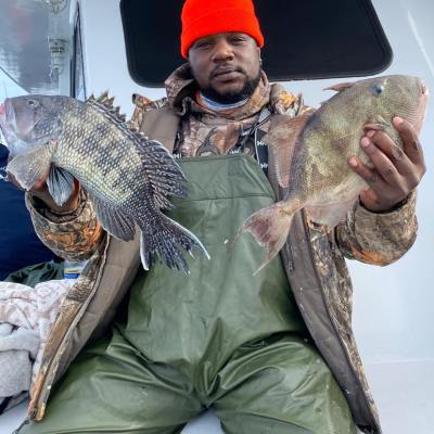 a man holding a fish