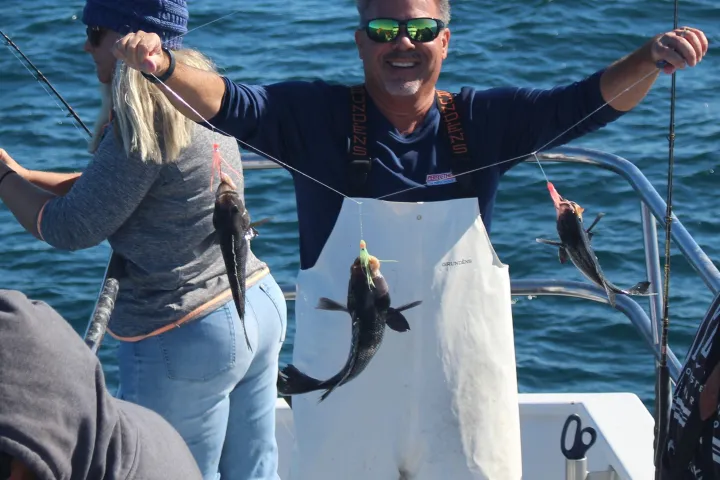 a person holding a fish in the water