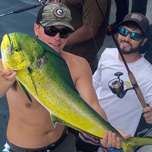 a group of people holding a banana