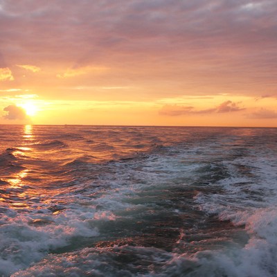 a sunset over a body of water