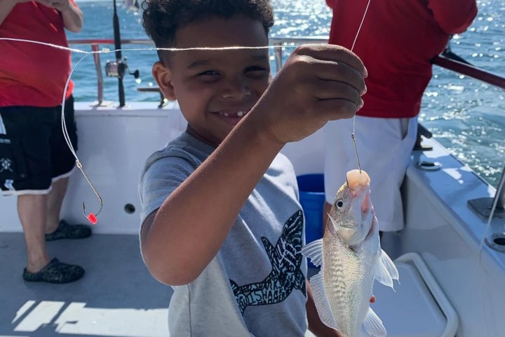 a person holding a fish