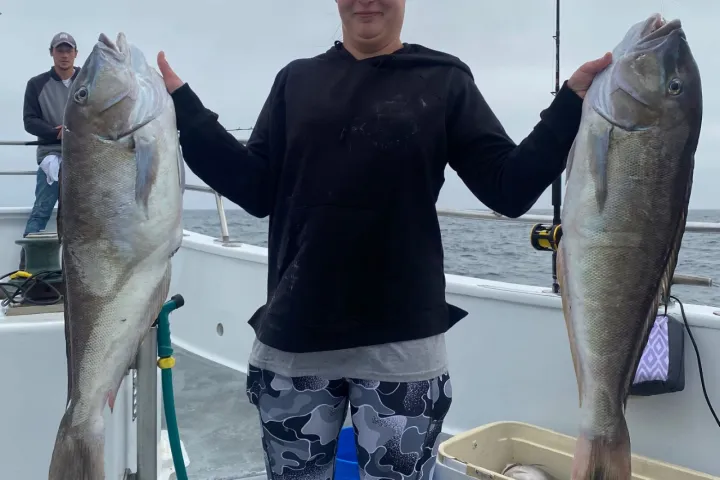a man holding a fish
