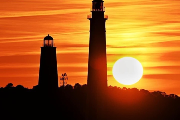 a tower with a sunset in the background