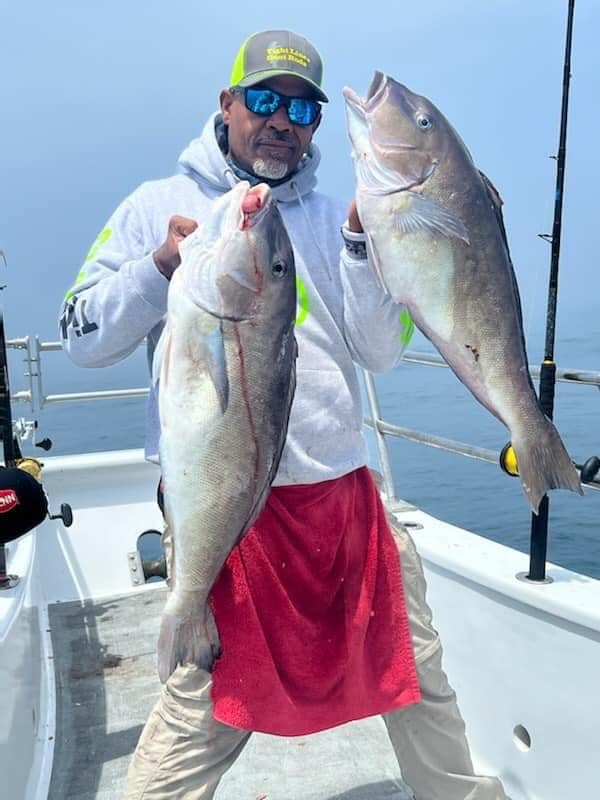 a man holding a fish