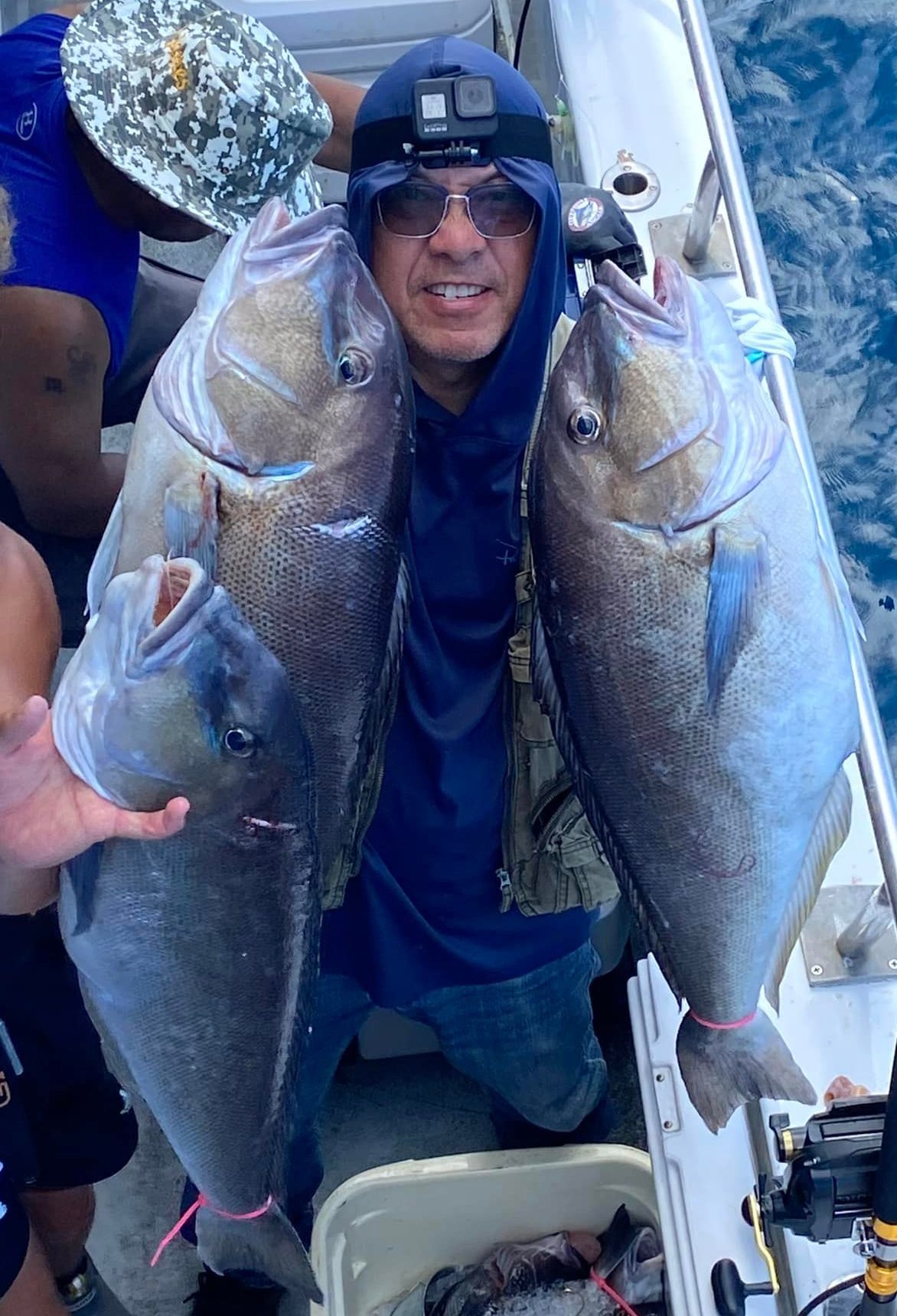 a person holding a fish