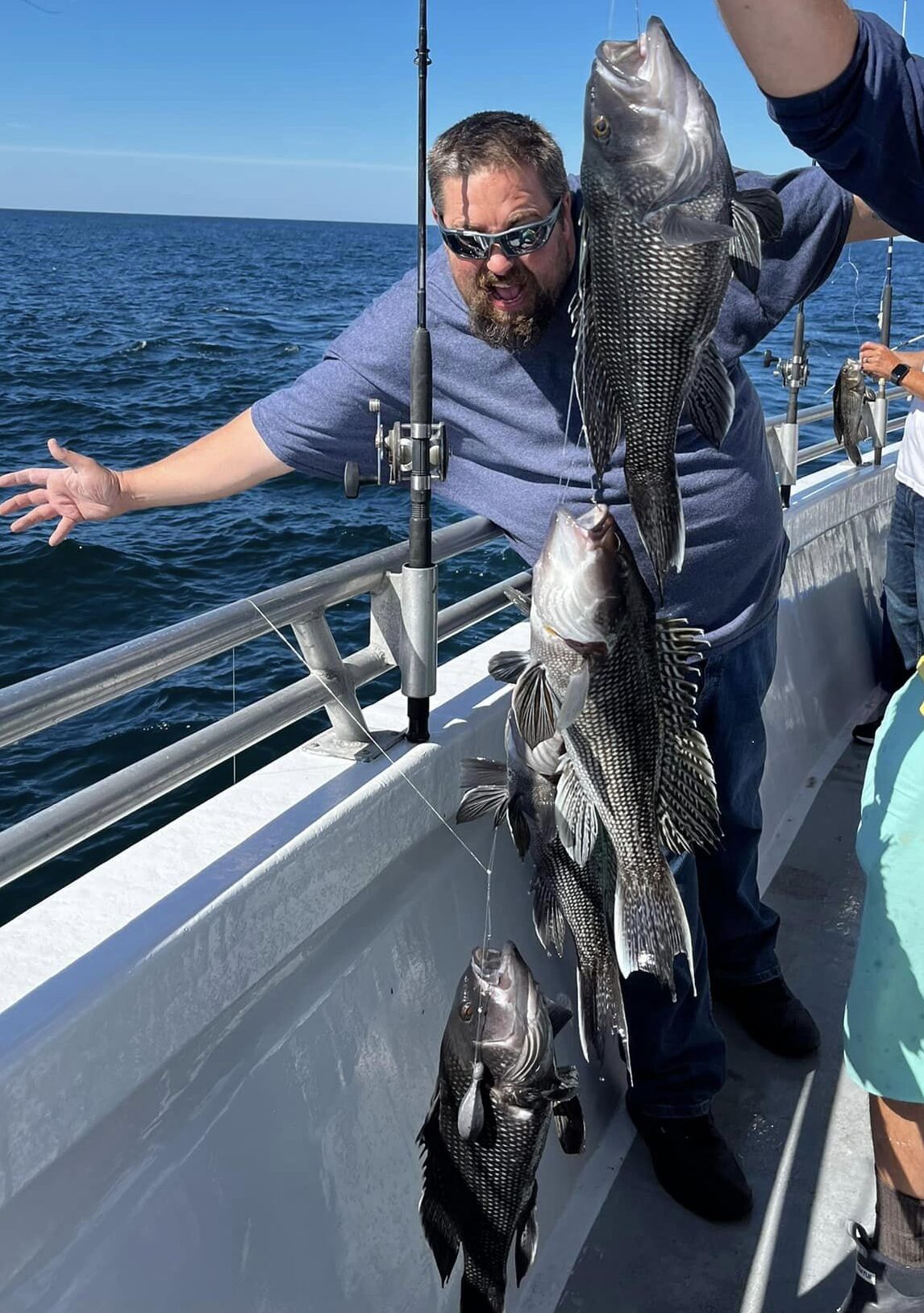 a man standing next to a boat