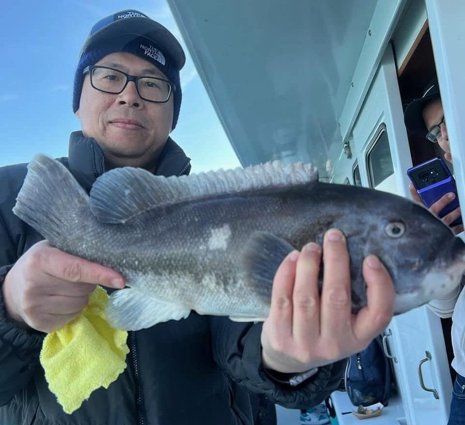 a man holding a fish