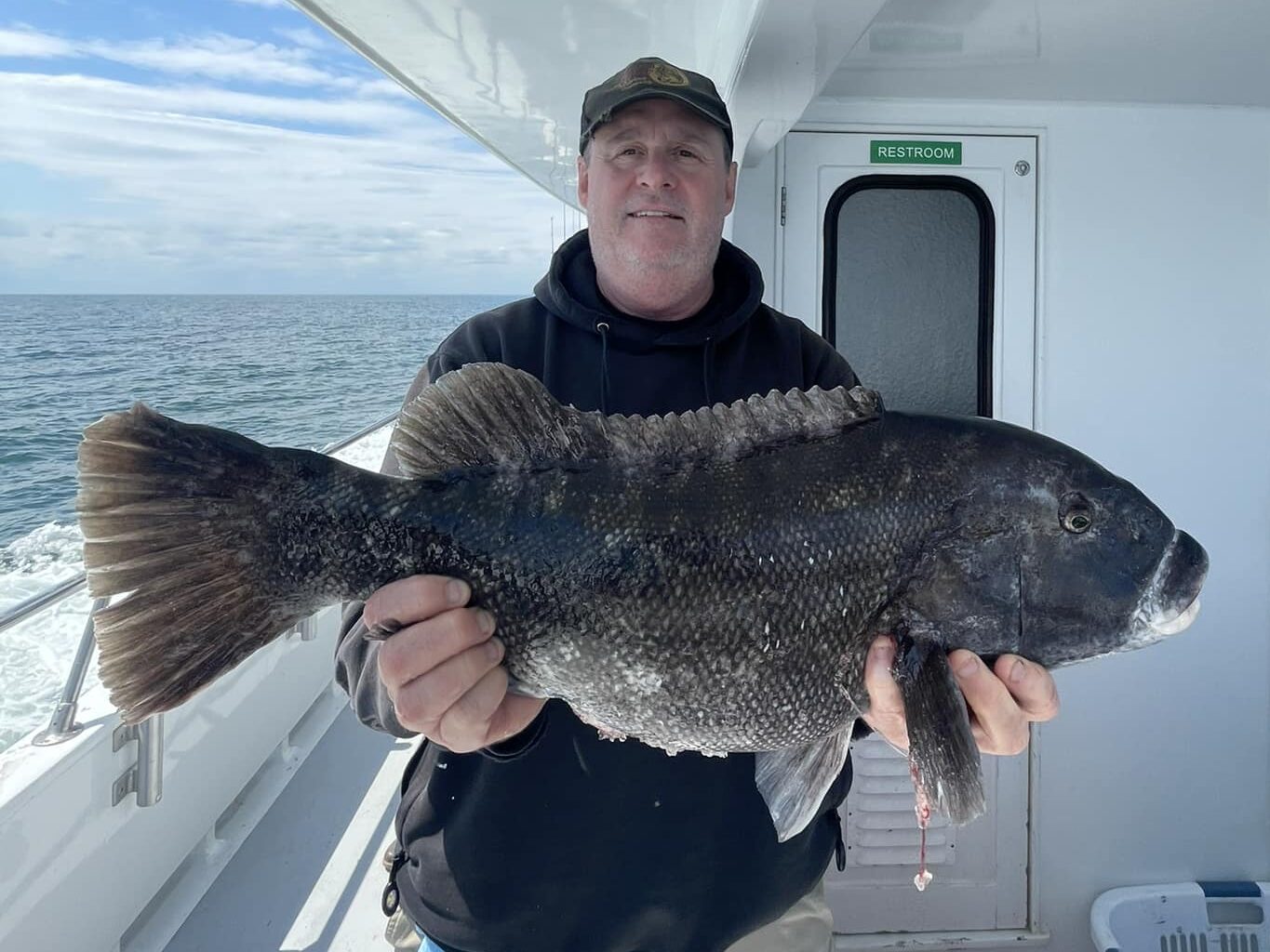 a man holding a fish