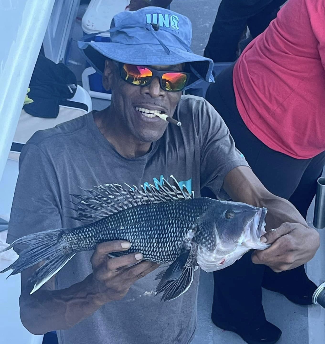 a man holding a fish