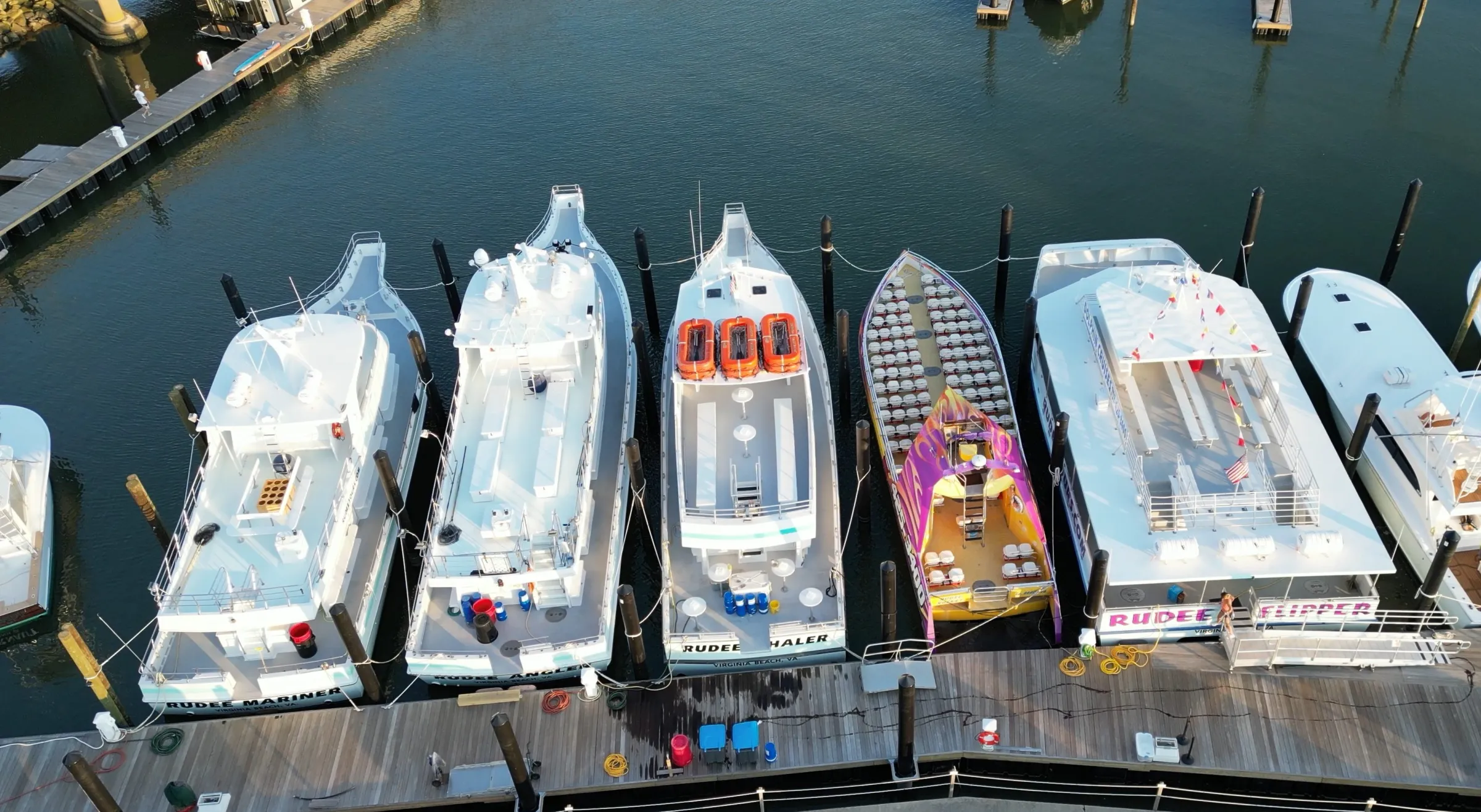 Aerial view of our 5 boats docked at the marina.